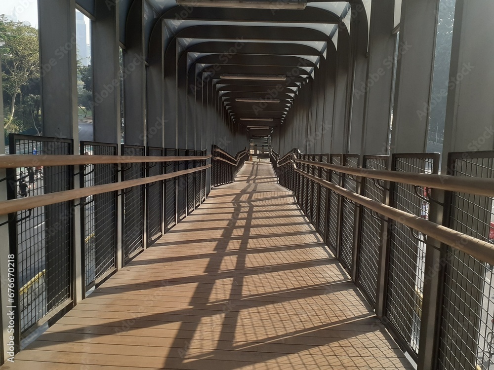 The architectural design of the pedestrian bridge and Transjakarta bus passenger transit stop, seen on Sunday morning.