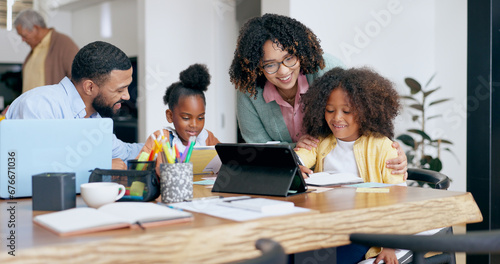 Parents, children and e learning with tablet, laptop and support for education, development and study at desk. Mother, father and kids with computer, online course and home school in family house