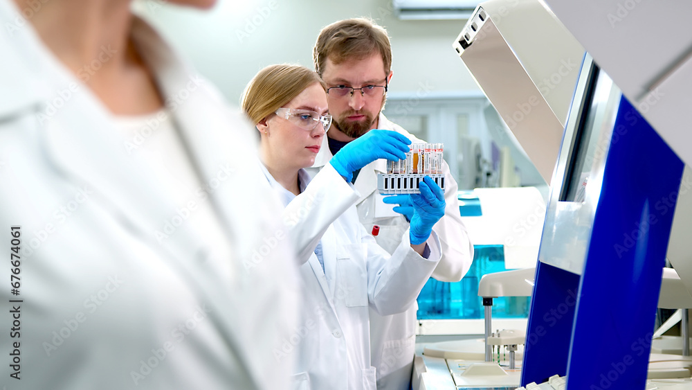 © wedmoments.stock - A medical research laboratory with a diverse team of biochemical scientists working with computers and modern medical technologies. Development of high-tech equipment for medicines. © wedmoments.stock - A medical research laboratory with a diverse team of biochemical scientists working with computers and modern medical technologies. Development of high-tech equipment for medicines.