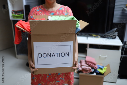 Clothes Donation, Renewable Concept.Box of Use Old Cloth. Preparing Garment at Home before Donate photo