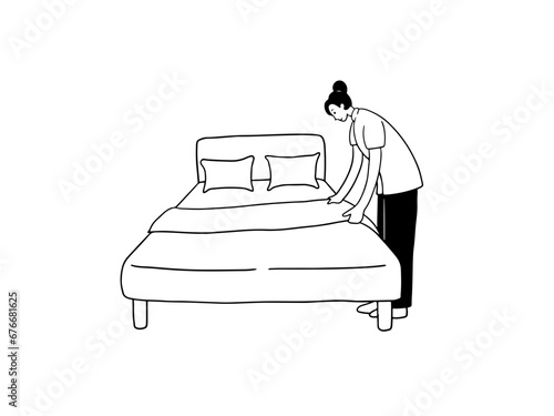 Hotel housekeeper making bed.