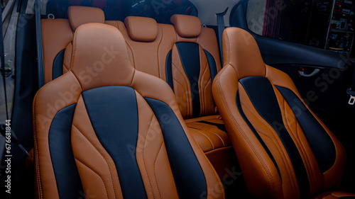 Custom car seat interiors use elegant motifs