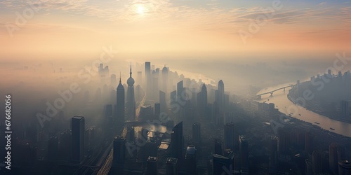 City veiled in sunrise. Aerial view with river and fog. Skyline and river amidst morning mist. Urban awakening over river and haze