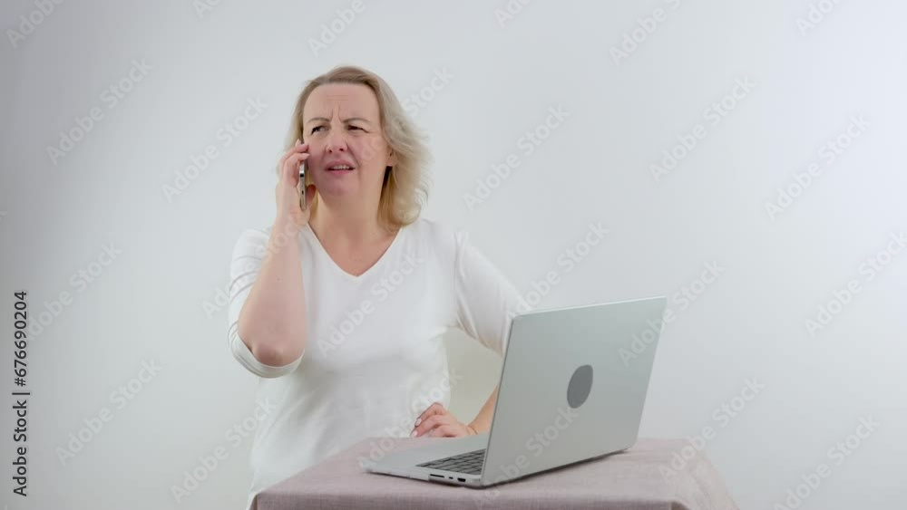 Frustrated woman having problem with not working smart phone sitting at home office desk, indignant confused businesswoman annoyed with discharged or broken cell, received bad news in mobile Call Frustrated woman having problem with not working smart phone sitting at home office desk, indignant confused businesswoman annoyed with discharged or broken cell, received bad news in mobile Call
