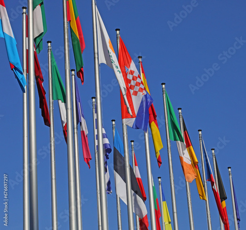 many flags of the states of the world during the intentional meeting and the background of the sky