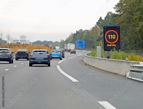 highway sign with speed limit of 110 km and the text RAPPEL which means REMEMBER in French photo