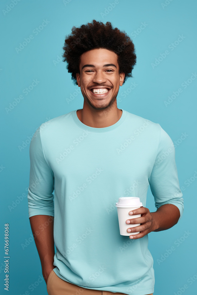 Happy African American man with cup of coffee on blue background Happy African American man with cup of coffee on blue background
