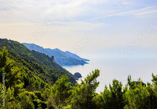 Fototapeta Naklejka Na Ścianę i Meble -  Coast and lonely rocks in the sea near Sinarades on the island of Corfu