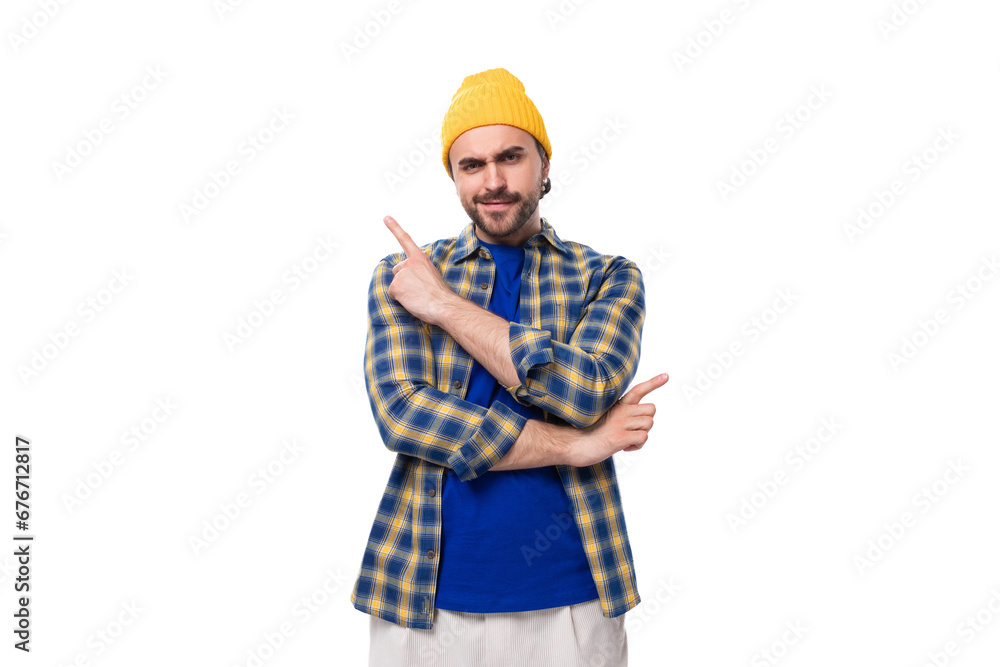 young handsome brunette man with a beard and mustache in a shirt and hat tells his idea young handsome brunette man with a beard and mustache in a shirt and hat tells his idea