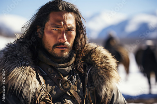 man warrior of an Asian Kazakh in ancient historical armor with a horse on background of mountains photo