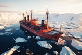 icebreaker ship sails through ice floes in ocean in winter. View from above