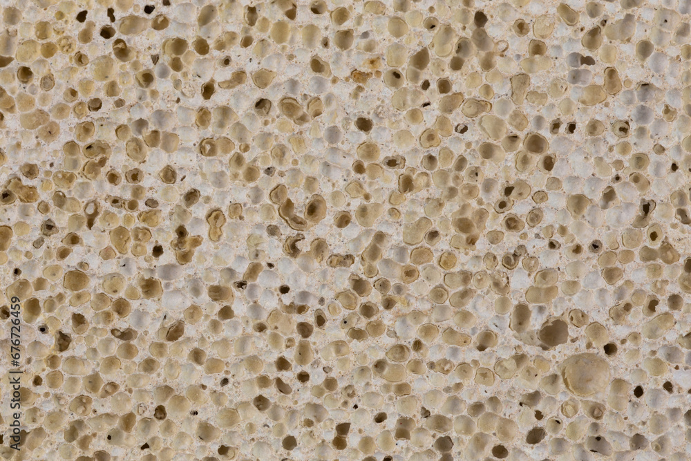 dirty pumice with peeled skin inside pores, macro texture and full-frame background.