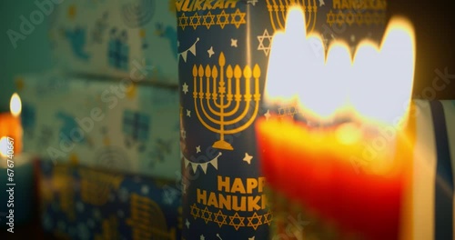 Hanukkah Table Set Decoration in the dark with Menorah and wraped up gifts photo