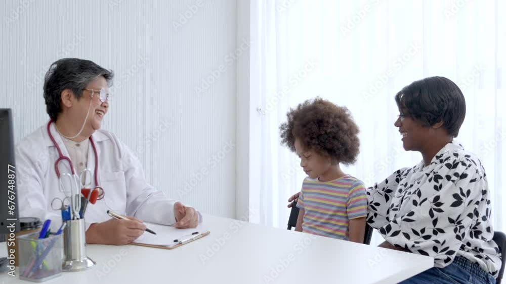 Elderly women doctor, child patient healthcare, check up and giving medical consultation of sick girl with her mother at hospital. Senior professional pediatrician having a case examination, wellness Elderly women doctor, child patient healthcare, check up and giving medical consultation of sick girl with her mother at hospital. Senior professional pediatrician having a case examination, wellness