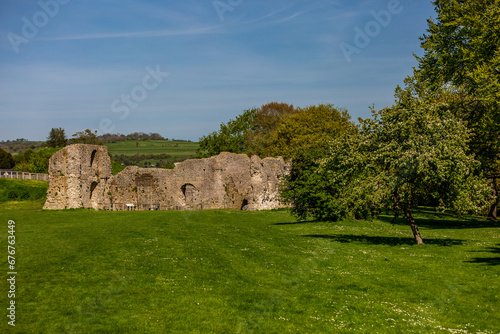 The ruins of Lewes Priory in Sussex, with a blue sky overhead photo