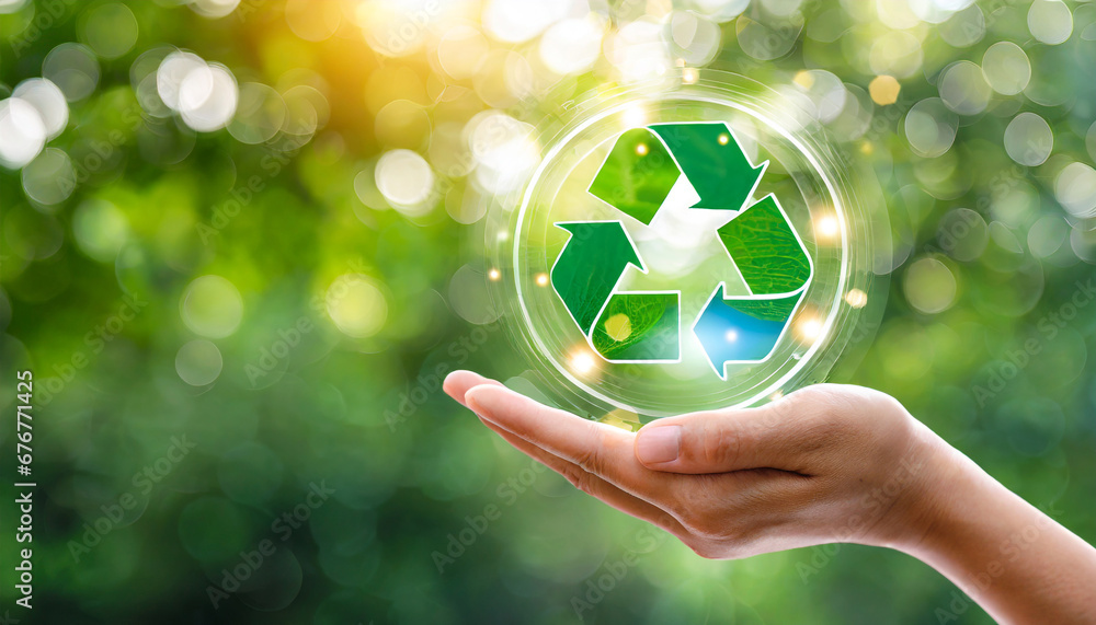 hand holding reduce reuse recycle symbol on green bokeh background ecological and save the earth concept an ecological metaphor for ecological waste management and a sustainable - obrazy, fototapety, plakaty 