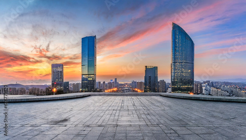 city square and skyline with modern buildings at sunset photo