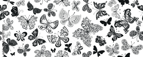 Vector fantasy seamless monochrome pattern with many lace black butterflies on the transparent background. photo