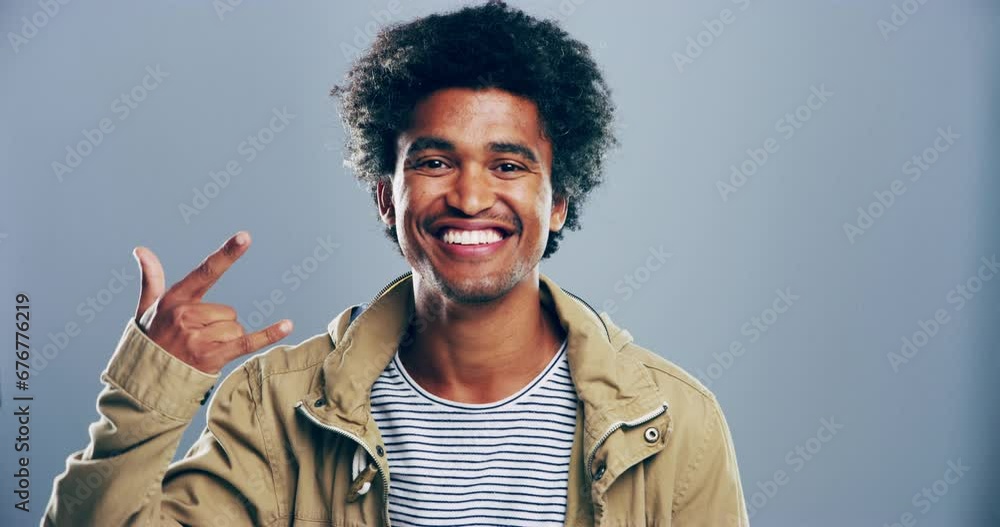 Portrait, rock and roll with black man, hand sign and artist with culture on a grey studio background. Face, African person and model with creativity, aesthetic or symbol with punk, heavy metal music Portrait, rock and roll with black man, hand sign and artist with culture on a grey studio background. Face, African person and model with creativity, aesthetic or symbol with punk, heavy metal music