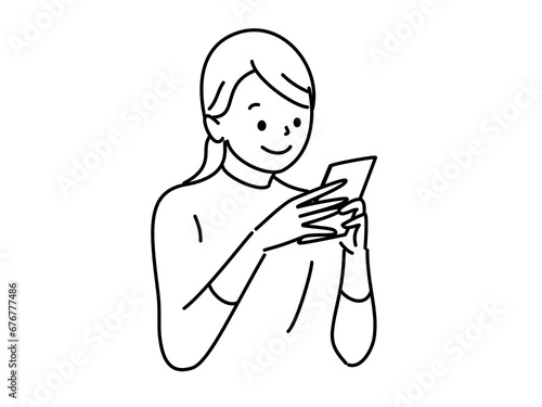 両肘をついてスマホを操作する女性