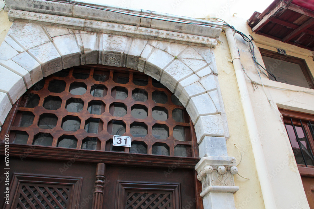 wood door and stone arc in rethymno in crete in greece