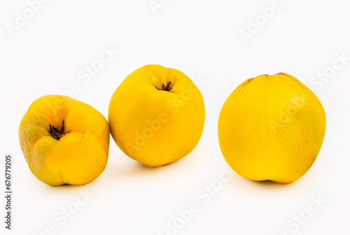 quince fruits on white background