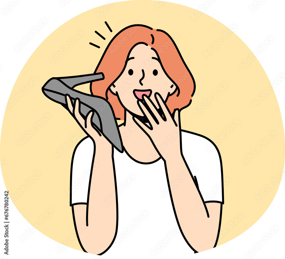 Stunned woman talk on shoe phone Stunned woman talk on shoe phone