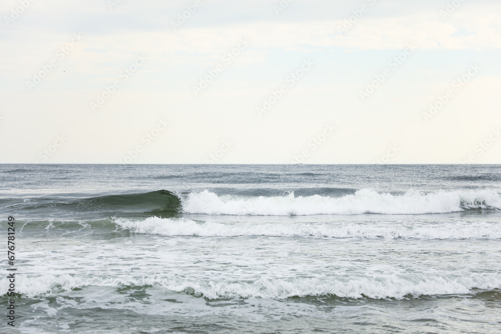 beach waves, a soothing symphony of nature's power and serenity, crashing on a sandy shore under a clear blue sky beach waves, a soothing symphony of nature's power and serenity, crashing on a sandy shore under a clear blue sky