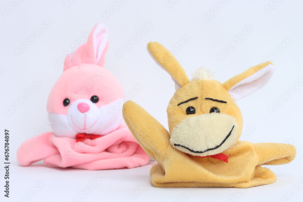 Soft hand puppet toy on a white background. Puppet show concept. Soft hand puppet toy on a white background. Puppet show concept.