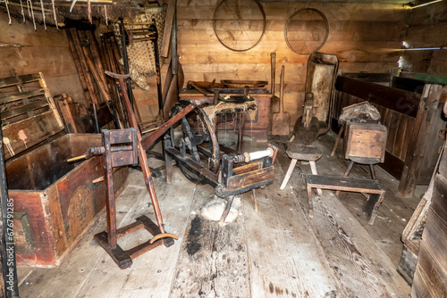 Historic shed with various rural tools objects and objects