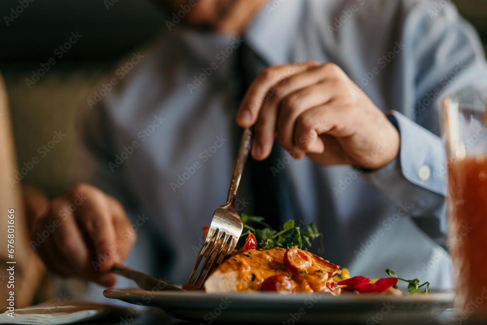 Hands of an elegant couple eating together in the restaurant. Hands of an elegant couple eating together in the restaurant.
