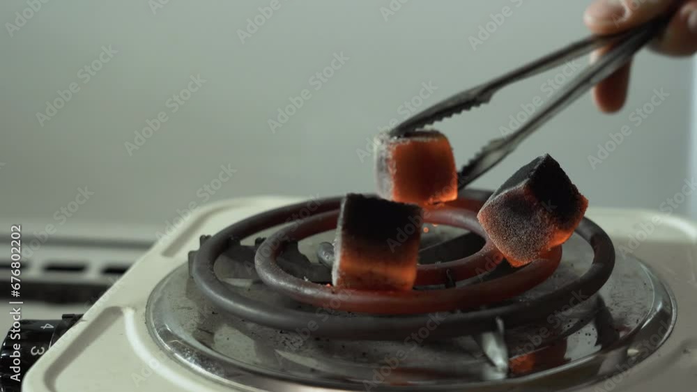 red charcoal for hookahs, turned over on an electric stove red charcoal for hookahs, turned over on an electric stove