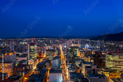 sunset or sun rise of Sapporo cityscape with Skyline and office building and downtown of sappiro is populars ciy from toursim Hokkaido, Japan with twilight sky in spring season