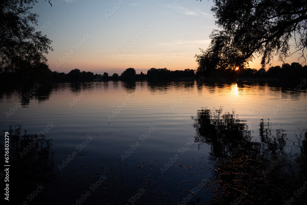 Obraz premium sunset on the river