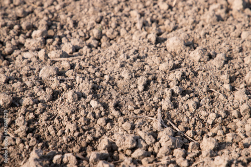 Closeup Focus Brown crushed soil peat field abstract texture background