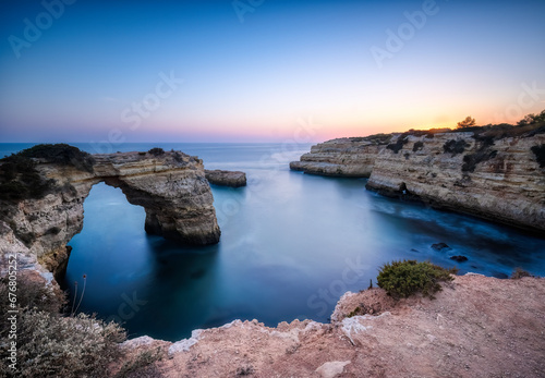 The rock arch known as Arco de Albandeira at Albandeira beach or Praia De Albandeira on the southern Algrave coast of Portugal