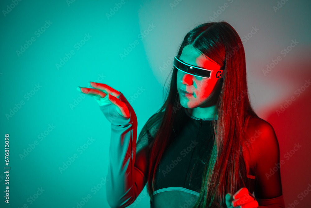 Fototapeta premium Futuristic transgender person using augmented reality smart goggles