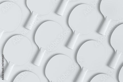 Pattern from ping pong rackets for table tennis on monochrome background