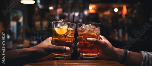 Two hands clink glass of alcoholic drink in bar on blur background. AI generated