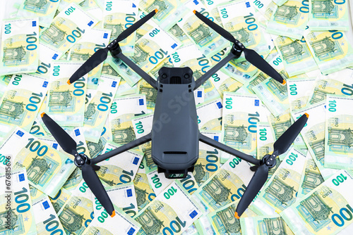 Top view on Aerial mavic Drone over euro bills as background, cost of modern technology concept