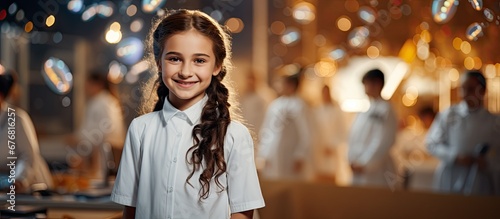 In the background of a bustling school a young girl in a white uniform unleashes her passion for education embracing the happy atmosphere alongside her team of dedicated students and friends