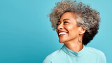 MATURE FASHIONABLE LAUGHING AFRICAN AMERICAN WOMAN ON BLUE BACKGROUND. legal AI