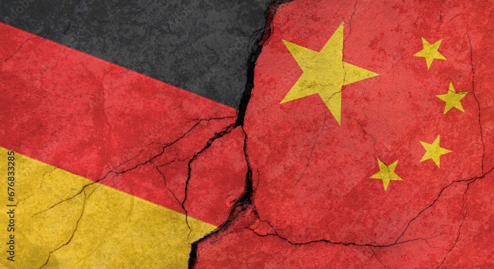 Germany and China flags, concrete wall texture with cracks, grunge background, military conflict concept
