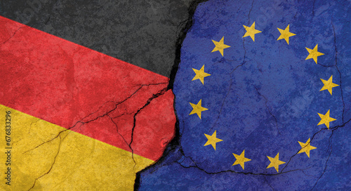 Germany and European Union flags, concrete wall texture with cracks, grunge background, military conflict concept