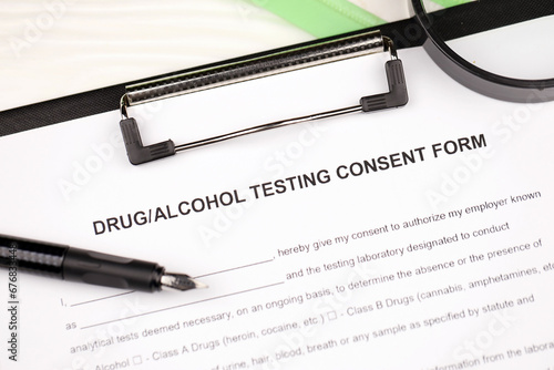 Tableau sur toile Drug and alcohol testing consent form on A4 tablet lies on office table with pen