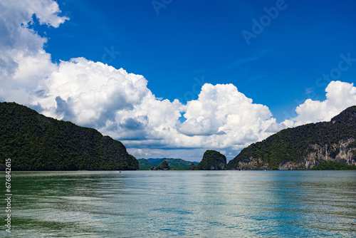 Unidentifiable tour boat cruising among the scenic limestone islands in Phang Nga Bay