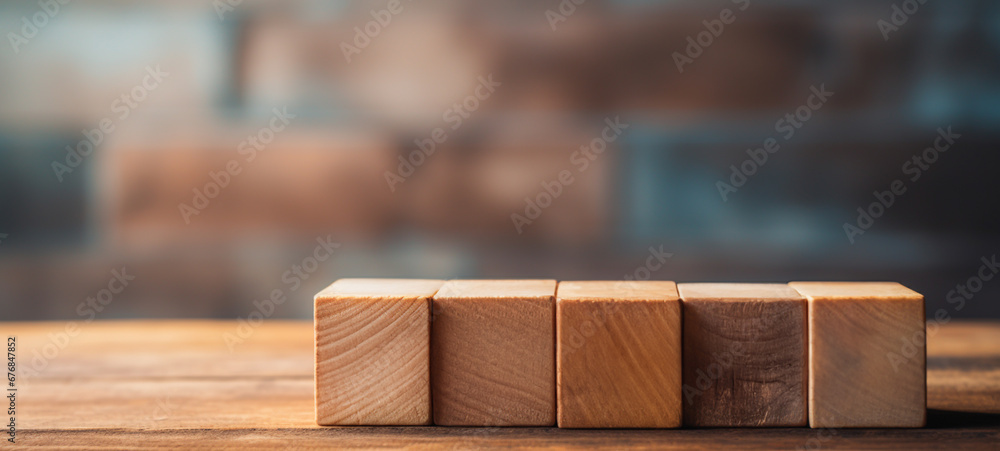 A stack of wooden blocks cube on top of a wooden table. Copy space, Business art concept A stack of wooden blocks cube on top of a wooden table. Copy space, Business art concept
