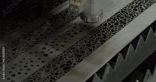 Automatic laser cutter at work photo