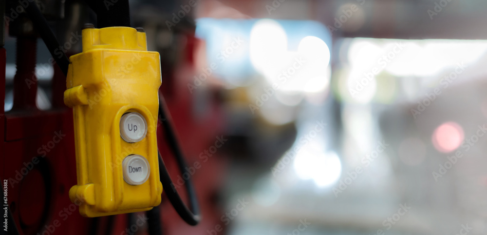 Fototapeta premium Overhead crane control switch at factory warehouse Close-up pictures of industrial work