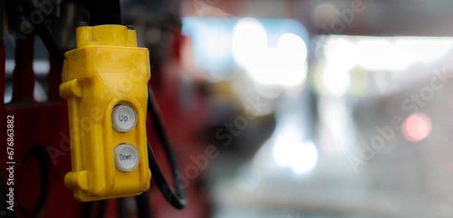 Overhead crane control switch at factory warehouse Close-up pictures of industrial work
